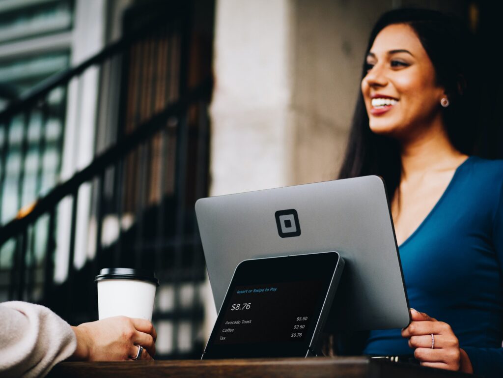 how to align your brand with your brand strategy - customer smiling over a counter 